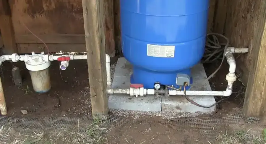 Private well pressure tank and supply fittings in a Hernando County pump house